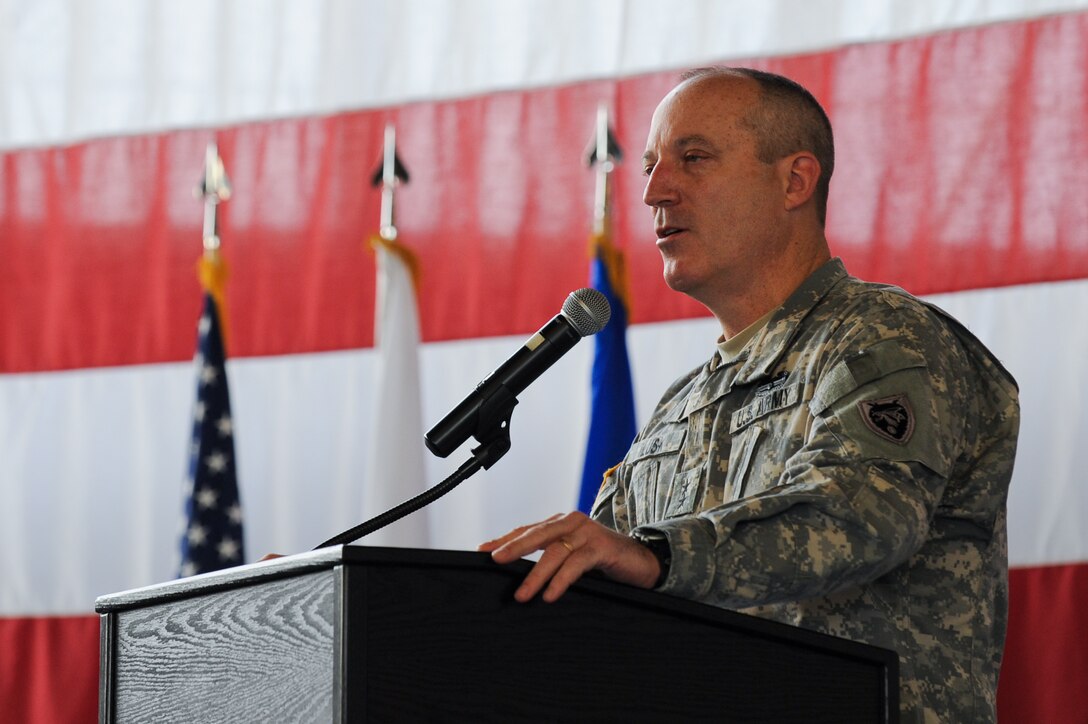 Army Maj. Gen. Gregory Lusk, North Carolina National Guard adjutant general-air, thanks Airmen of the 28th Bomb Wing for their vital support at a ceremony in the Pride Hangar on Ellsworth Air Force Base, S.D, Nov. 28, 2012. More than 350 Ellsworth Airmen assisted in the recovery of a crashed C-130 near Edgemont, S.D., during July 2012, which included a dignified transfer of the deceased personnel and safe removal of more than 400 tons of aircraft parts and material from a four-acre incident debris field. (U.S. Air Force photo by Airman 1st Class Kate Thornton-Maurer/Released)  