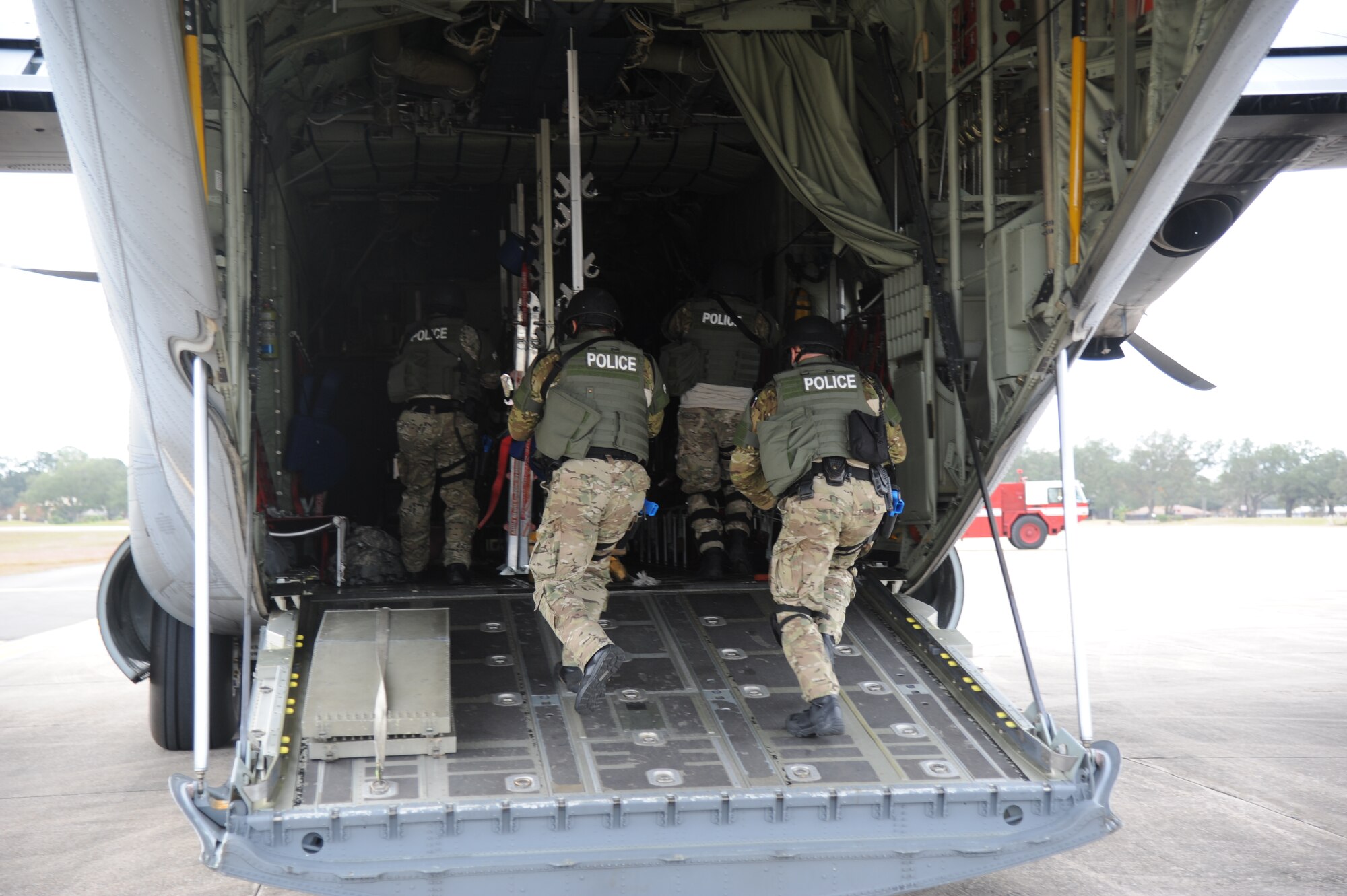 The Biloxi Police Department Special Response Team secures an aircraft during an anti-hijacking exercise on the flightline at Keesler Air Force Base, Miss., Dec. 4, 2012. The exercise scenario consisted of a disgruntled Airman, who after being denied leave during the holidays, created a fake Air Force leave form to get on a flight and hijack the aircraft to fly home.  (U.S. Air Force photo by Kemberly Groue)