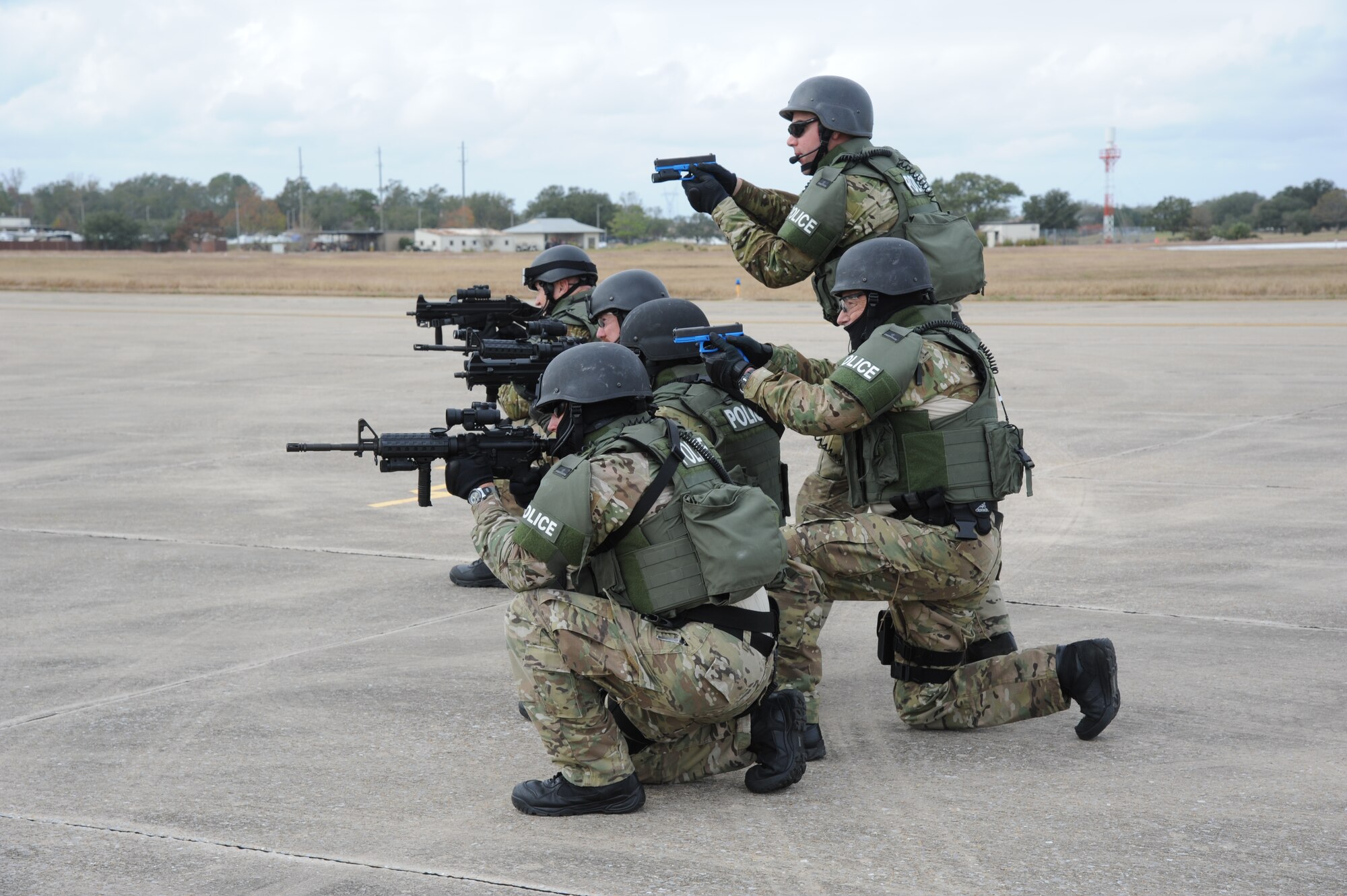 The Biloxi Police Department Special Response Team prepares to secure an aircraft and its passengers during an anti-hijacking exercise on the flightline at Keesler Air Force Base, Miss., Dec. 4, 2012. The exercise scenario consisted of a disgruntled Airman, who after being denied leave during the holidays, created a fake Air Force leave form to get on a flight and hijack the aircraft to fly home.  (U.S. Air Force photo by Kemberly Groue)