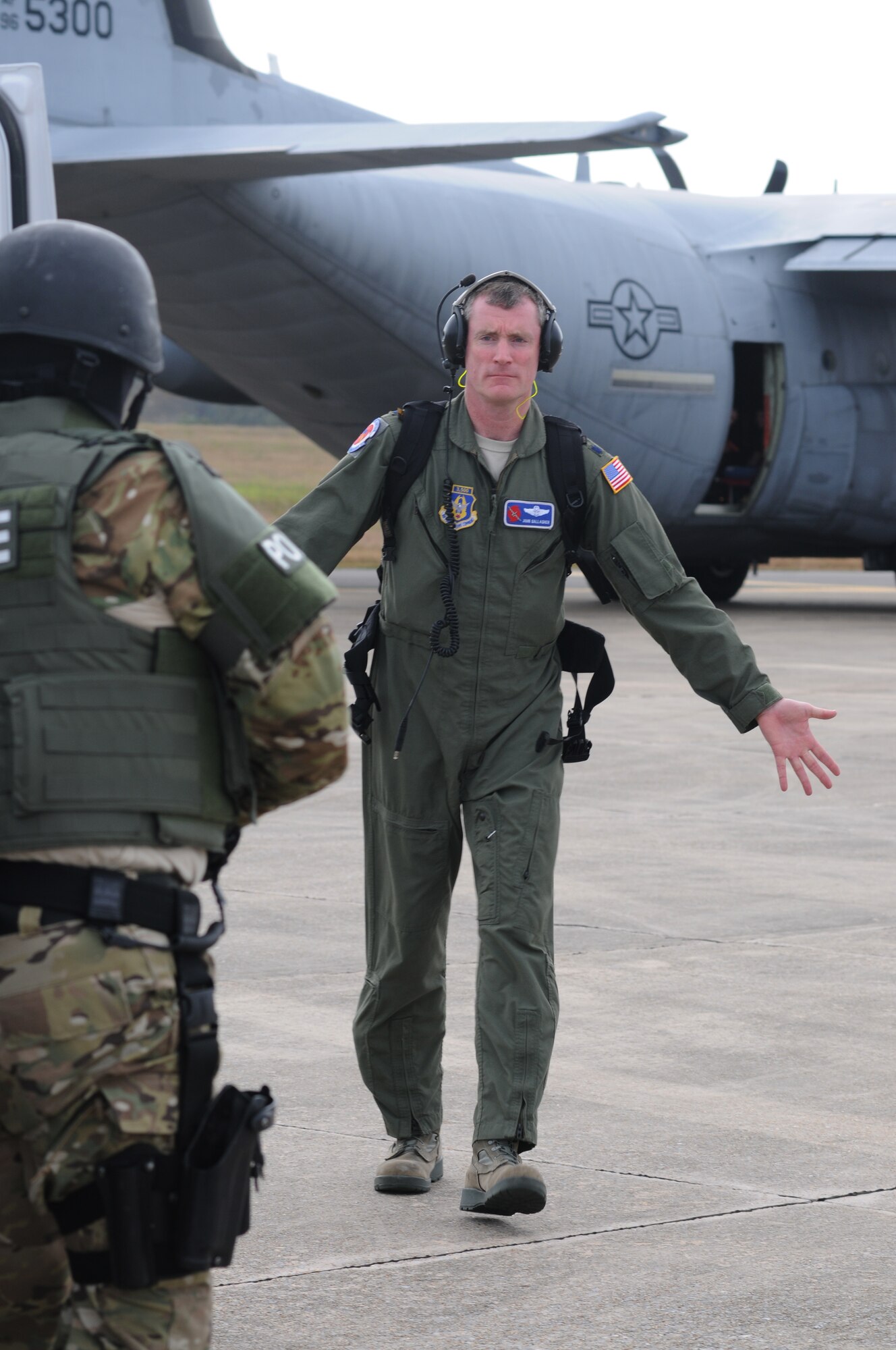 Lt. Col. John Gallagher, 53rd Weather Reconnaisance Squadron, portrays a “hostage” who is being released from the aircraft and turned over to the Biloxi Police Department Special Response Team during an anti-hijacking exercise on the flightline at Keesler Air Force Base, Miss., Dec. 4, 2012. The exercise scenario consisted of a disgruntled Airman, who after being denied leave during the holidays, created a fake Air Force leave form to get on a flight and hijack the aircraft to fly home.  (U.S. Air Force photo by Kemberly Groue)