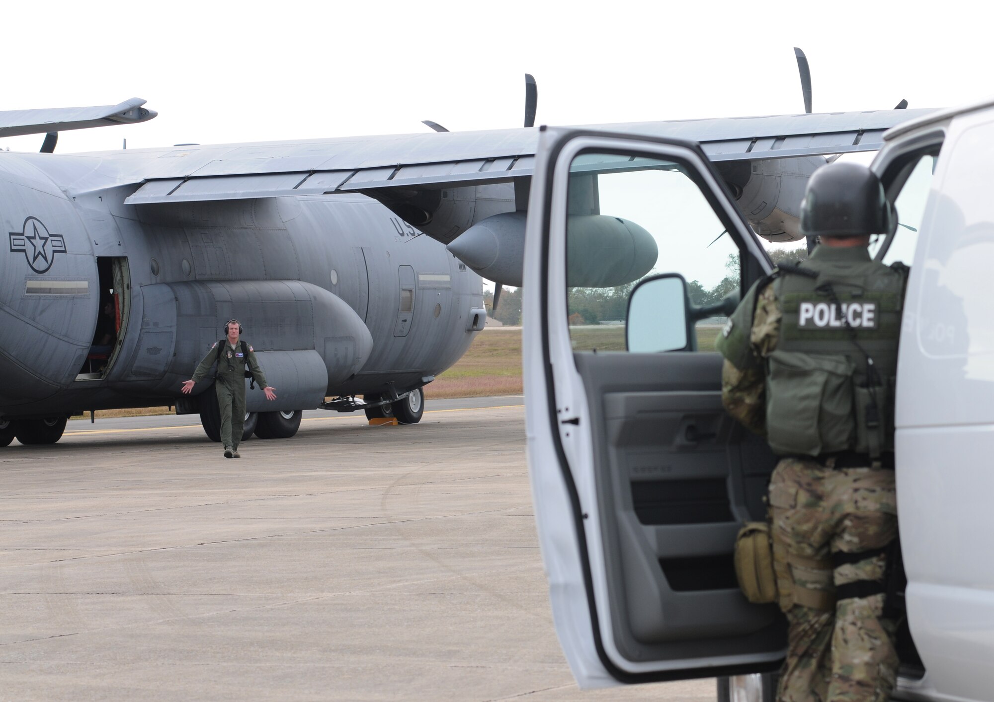 Lt. Col. John Gallagher, 53rd Weather Reconnaisance Squadron, portrays a “hostage” who is being released from the aircraft and turned over to the Biloxi Police Department Special Response Team during an anti-hijacking exercise on the flightline at Keesler Air Force Base, Miss., Dec. 4, 2012. The exercise scenario consisted of a disgruntled Airman, who after being denied leave during the holidays, created a fake Air Force leave form to get on a flight and hijack the aircraft to fly home.  (U.S. Air Force photo by Kemberly Groue)