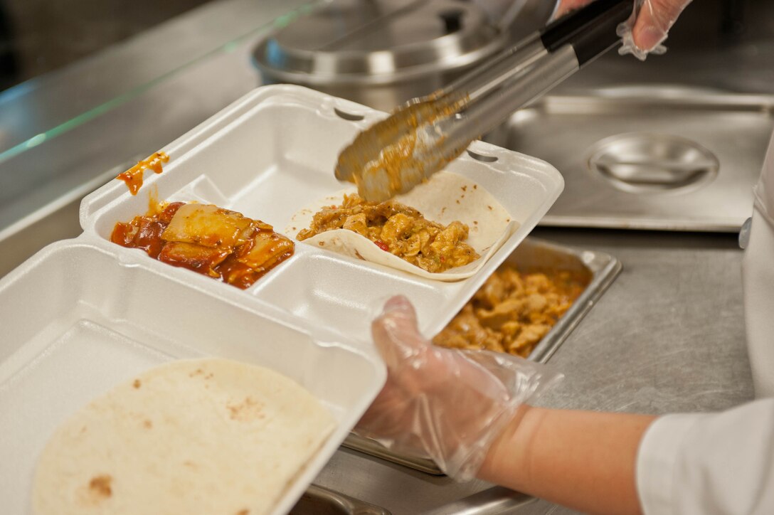 Staff Sgt. Anthony Arculeo, 28th Force Support Squadron flight kitchen cook, puts together a meal for an Airman in the flight kitchen at Ellsworth Air Force Base, S.D., Dec. 4, 2012. The flight kitchen has a 14-day menu which incorporates a variety of entrees, soups and salads, chosen by popular demand from Airmen base-wide. (U.S. Air Force photo by Airman 1st Class Zachary Hada/Released)