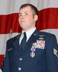 Wisconsin Air National Guard Staff Sgt. Timothy I. Donnan, of the 115th Explosive Ordnance Disposal flight, receives the Purple Heart from Maj. Gen. Donald P. Dunbar, adjutant general of Wisconsin, in a ceremony at Truax Field, Madison, Wis., Dec. 3. Donnan was awarded the Purple Heart for injuries received from a roadside bomb while deployed to Afghanistan. (U.S. Air Force photo by Master Sgt. Paul Gorman)