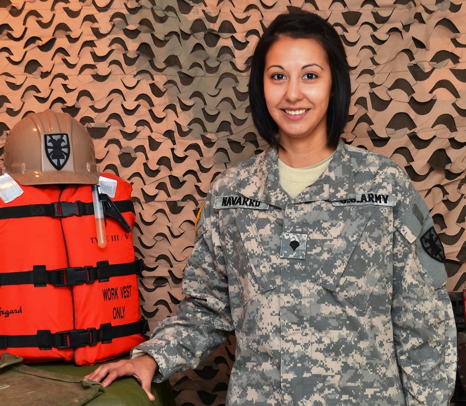 Spc. Rosie Navarro, transportation coordinator with the 382nd Transportation Theater Opening Element, Special Troops Battalion, 7th Sustainment Brigade, coordinated a collection drive which donated nearly 300 pounds of food and clothing before the Thanksgiving holiday to the Food Bank of Virginia to benefit families in the New York-New Jersey area.  (U.S. Army courtesy photo / Released)