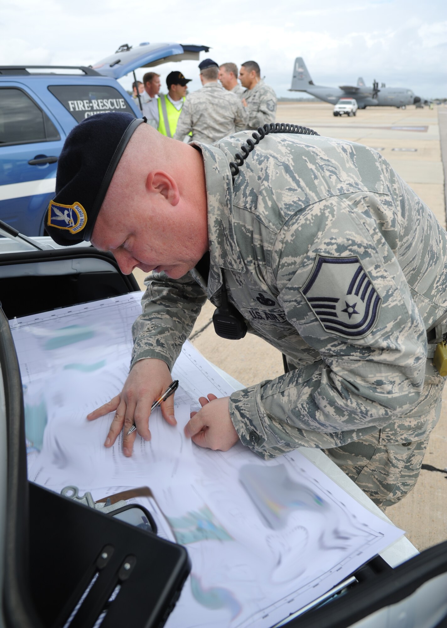 Master Sgt. Billy Waller, 81st Security Forces Squadron, acts as the on-duty flight chief during an anti-hijacking exercise on the flightline at Keesler Air Force Base, Miss., Dec. 4, 2012. The exercise scenario consisted of a disgruntled Airman, who after being denied leave during the holidays, created a fake Air Force leave form to get on a flight and hijack the aircraft to fly home.  (U.S. Air Force photo by Kemberly Groue)