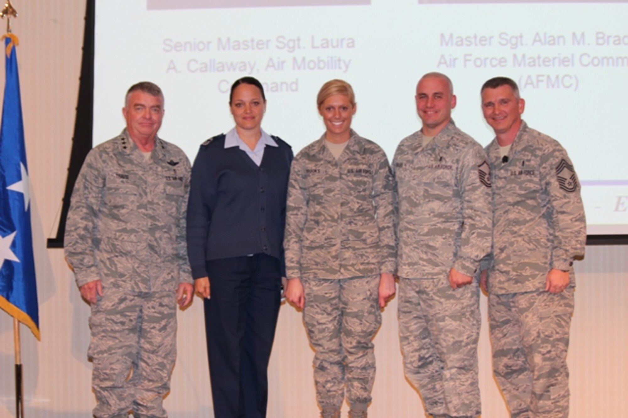 Lt. Gen. (Dr.) Thomas W. Travis, Air Force Surgeon General, and Chief Kevin
J. Lambing, Chief, Medical Enlisted Force, greet the three medics of the 10
Outstanding Airmen of the Year during the Air Force Medical Service Senior
Leadership Workshop on Dec. 4 here. The Airmen, in order from left to right,
are Senior MSgt. Laura Callaway, MSgt. Alan Braden and Senior Airman Bryenna
Brooks. (U.S. Air Force photo/Jon Stock)
