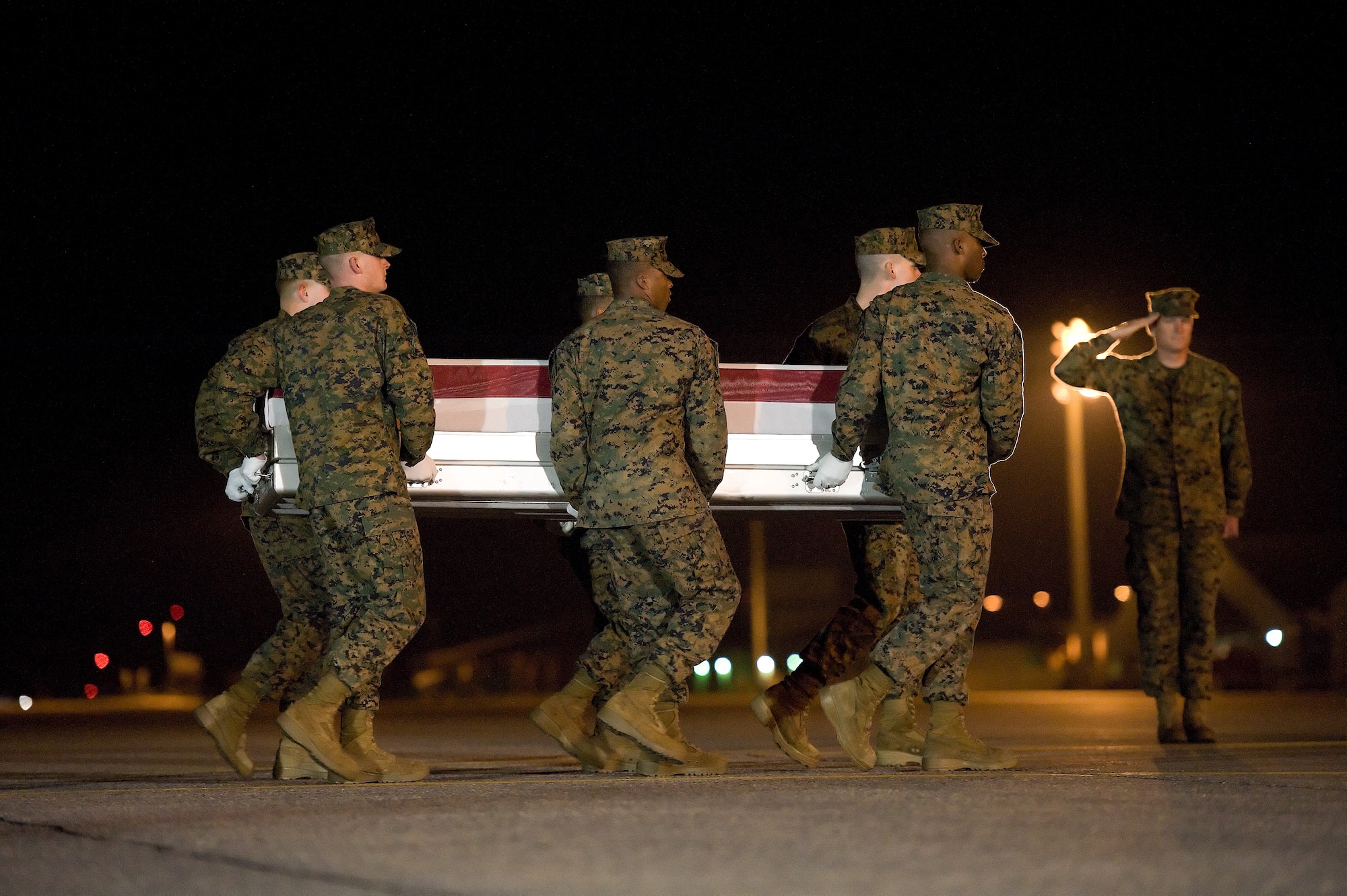 A U.S. Marine Corps carry team transfers the remains of Marine Lance Cpl. Anthony J. Denier of Mechanicsville, N.Y., at Dover Air Force Base, Del., Dec. 4, 2012. Denier was assigned to 3rd Battalion, 9th Marines, 2nd Marine Division, II Marine Expeditionary Force, Camp Lejeune, N.C. (U.S. Air Force photo/Greg L. Davis)
