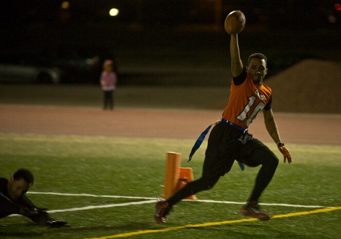 Giovanni Sumpter, 99th Communications Squadron, catches a 20-yard touchdown pass during the intramural championship game against the 99th Security Forces Squadron Nov 29, 2012, at Nellis Air Force Base’s Warrior Fitness Center Football Field. The Communications team came into the game with two losses and played a Security Forces team that had not lost a game this season.  (U.S. Air Force Photo by Senior Airman Daniel Hughes)