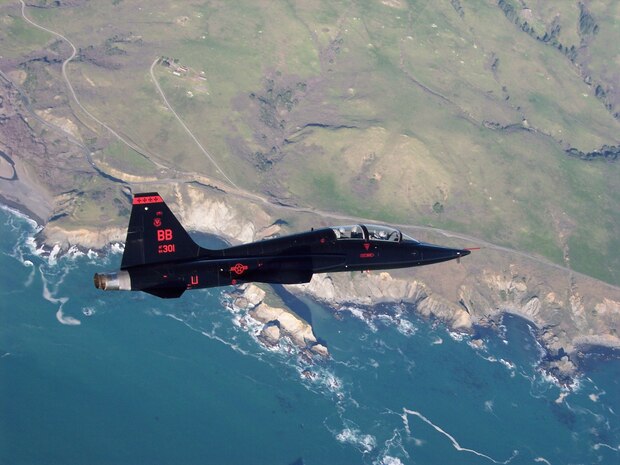 A T-38 Talon from Beale Air Force Base flies above the central California coastline. (Courtesy Photo/ Released)