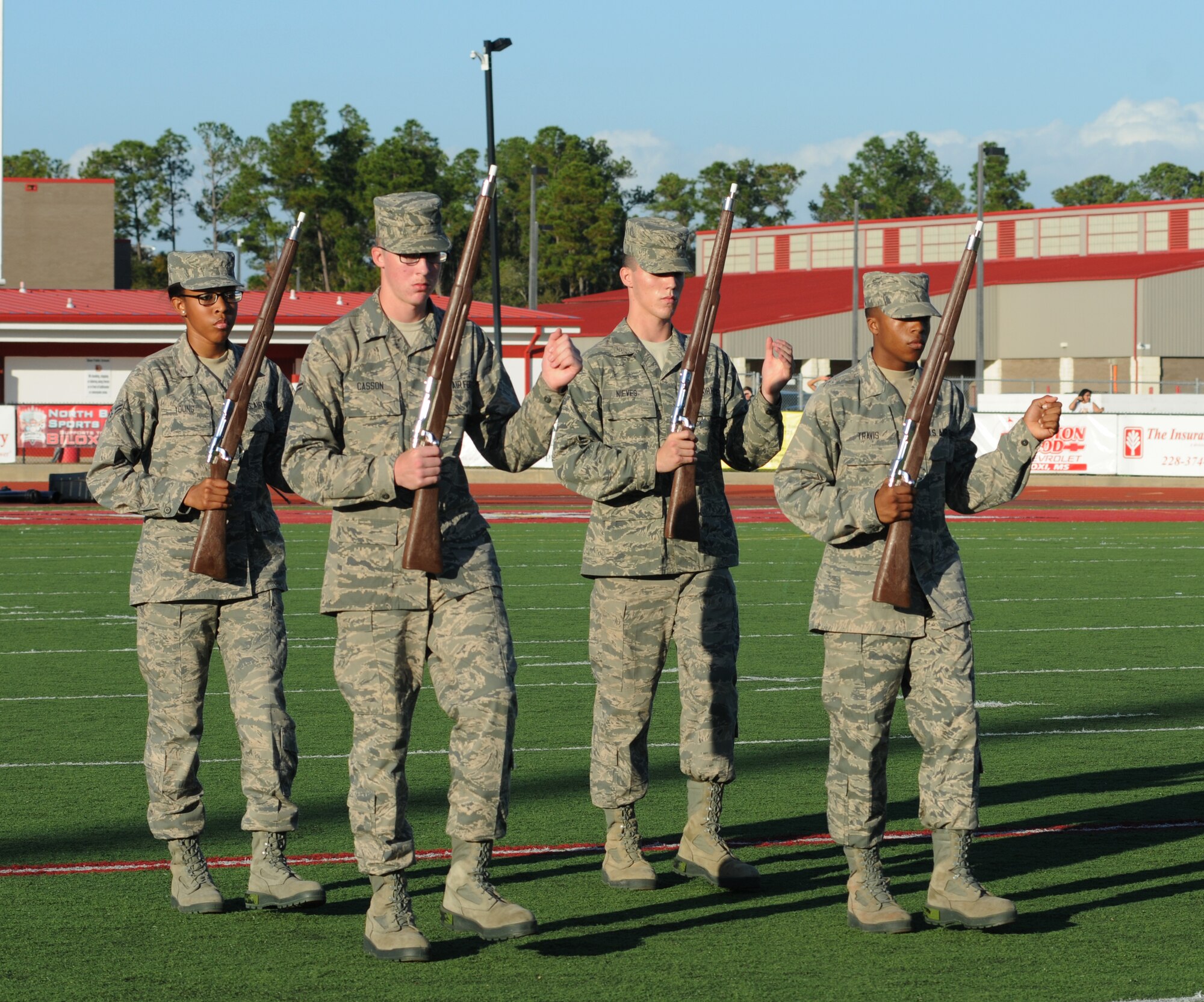 Members of the 336th Training Squadron drill team perform in a drill down competition during half time at the 2012 Mississippi Bowl at the Biloxi High School football stadium Dec. 2, 2012. The 336th TRS was selected as the winner of the competition by audience applause.  Other participation from Keesler Air Force Base, Miss., included the 50-State Flag Team, the Honor Guard, and a C-130J Hercules fly over by the 403rd Wing.   (U.S. Air Force photo by Kemberly Groue)