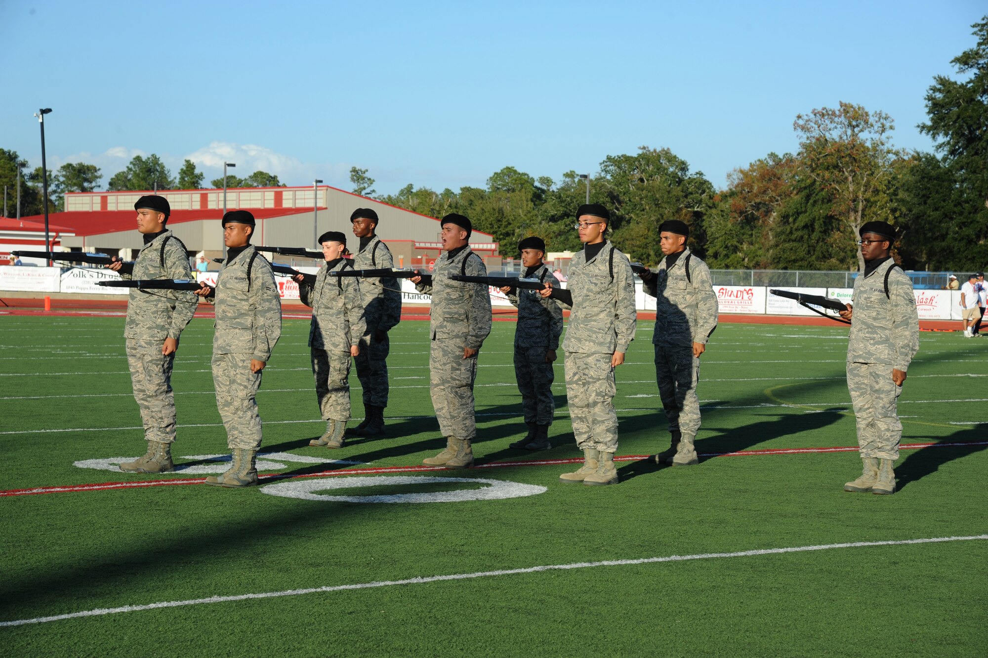 Members of the 338th Training Squadron drill team perform in a drill down competition during half time at the 2012 Mississippi Bowl at the Biloxi High School football stadium Dec. 2, 2012. The 336th Training Squadron was selected as the winner of the competition by audience applause.  Other participation from Keesler Air Force Base, Miss., included the 50-State Flag Team, the Honor Guard, and a C-130J Hercules fly over by the 403rd Wing.   (U.S. Air Force photo by Kemberly Groue)