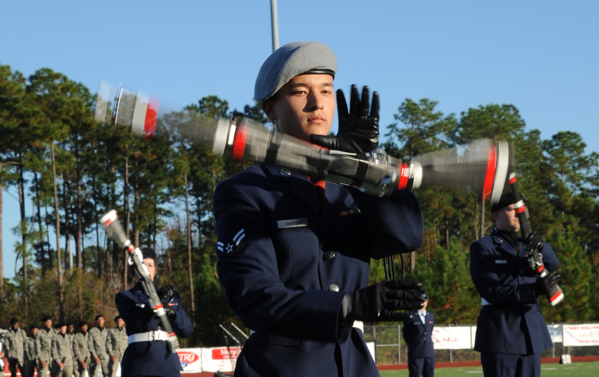 Airman 1st Class Kyle Harayda, 335th Training Squadron, spins his weapon in a drill down competition during half time at the 2012 Mississippi Bowl at the Biloxi High School football stadium Dec. 2, 2012. The 336th Training Squadron was selected as the winner of the competition by audience applause.  Other participation from Keesler Air Force Base, Miss., included the 50-State Flag Team, the Honor Guard, and a C-130J Hercules fly over by the 403rd Wing.   (U.S. Air Force photo by Kemberly Groue)
