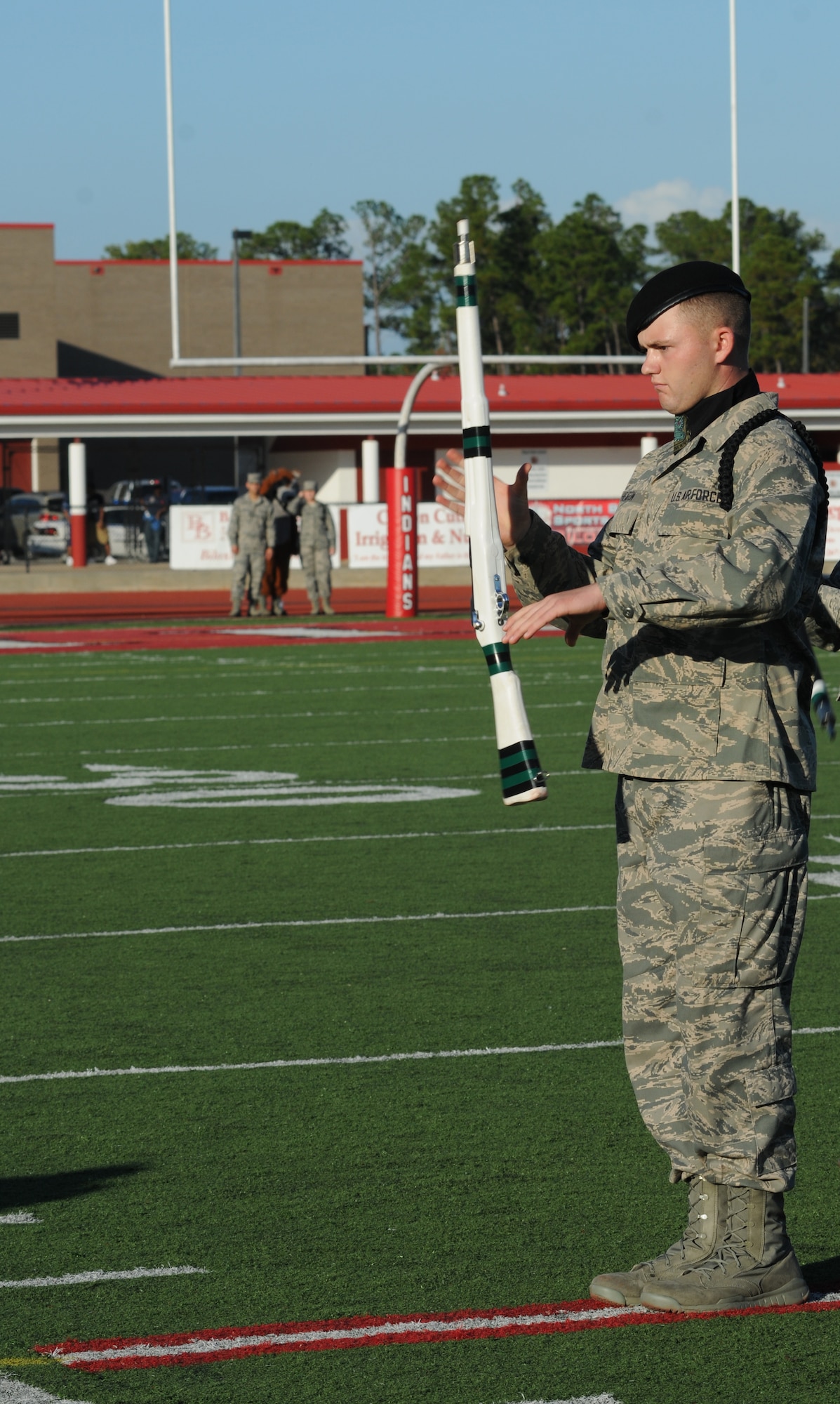 Airman Basic Ryan Heaton, 334th Training Squadron, spins his weapon in a drill down competition during half time at the 2012 Mississippi Bowl at the Biloxi High School football stadium Dec. 2, 2012. The 336th Training Squadron was selected as the winner of the competition by audience applause.  Other participation from Keesler Air Force Base, Miss., included the 50-State Flag Team, the Honor Guard, and a C-130J Hercules fly over by the 403rd Wing.  (U.S. Air Force photo by Kemberly Groue)
