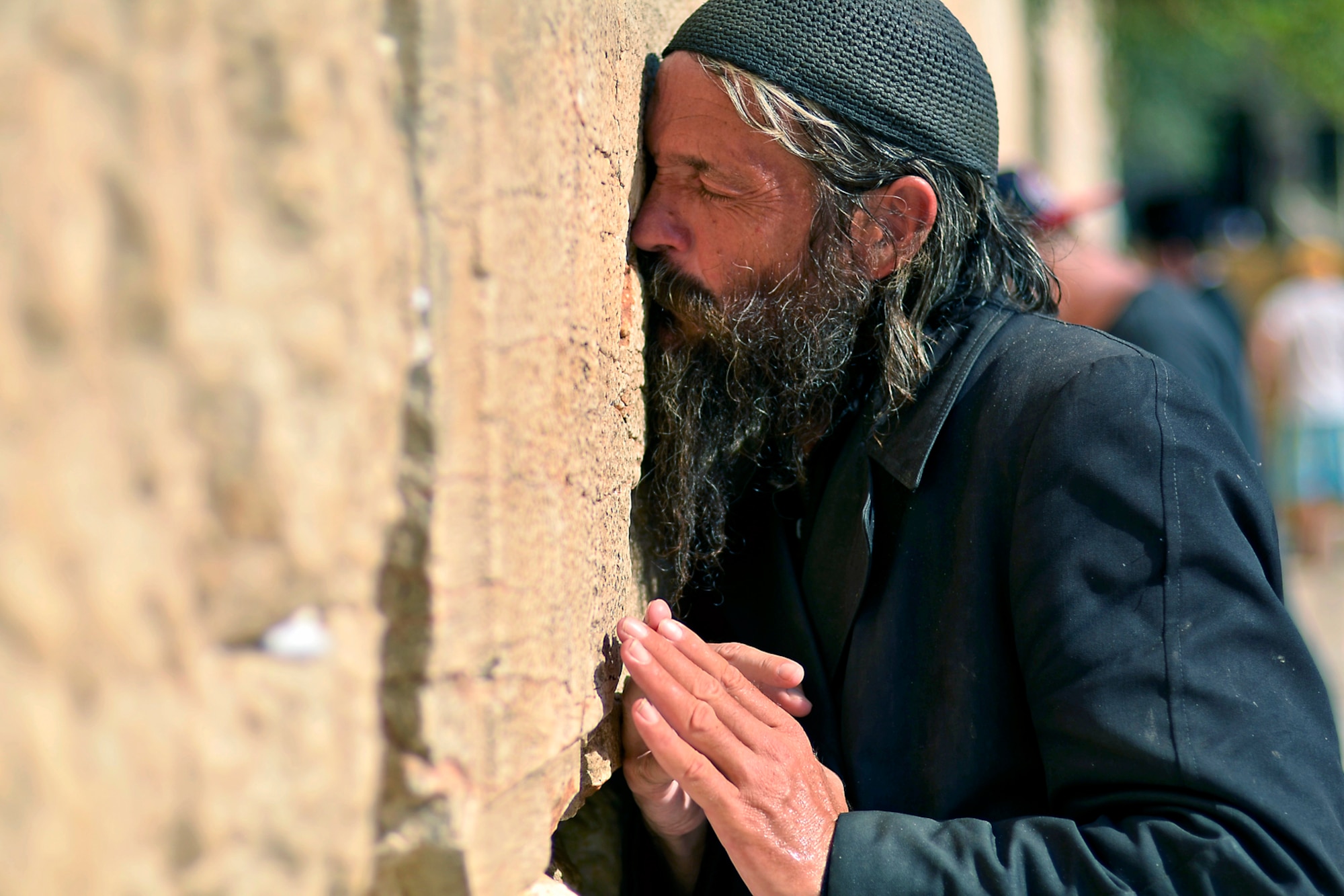 WRIGHT-PATTERSON AIR FORCE BASE, Ohio - A homeless elder man prays by the Wailing Wall in Jerusalem, Israel, July 27. Thousands of people visit the Western Wall daily. It is open for all religions and all races, but separated by sex. (U.S. Air Force photo/Staff Sgt. Mikhail Berlin)