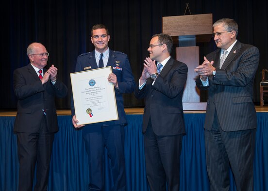 Capt. Ryan McGuire, a C-17 Globemaster III pilot with the 4th Airlift Squadron at Joint Base Lewis-McChord, Wash., was one of two service members recognized as Outstanding Department of Defense Service Member with Disabilities for 2012, at the 32nd Annual Department of Defense Disability Awards Ceremony held in the Pentagon, Washington, D.C., on Dec. 04, 2012. The captain is pictured with, from left to right, Frederick E. Vollrath, performing the duties of assistant secretary of defense for readiness and force management; Daniel Ginsberg, the Air Force assistant secretary for Manpower and Reserve Affairs; and Bob Corsi, Air Force assistant deputy chief of staff for Manpower, Personnel and Services. (U.S. Air Force photo/Jim Varhegyi) 

