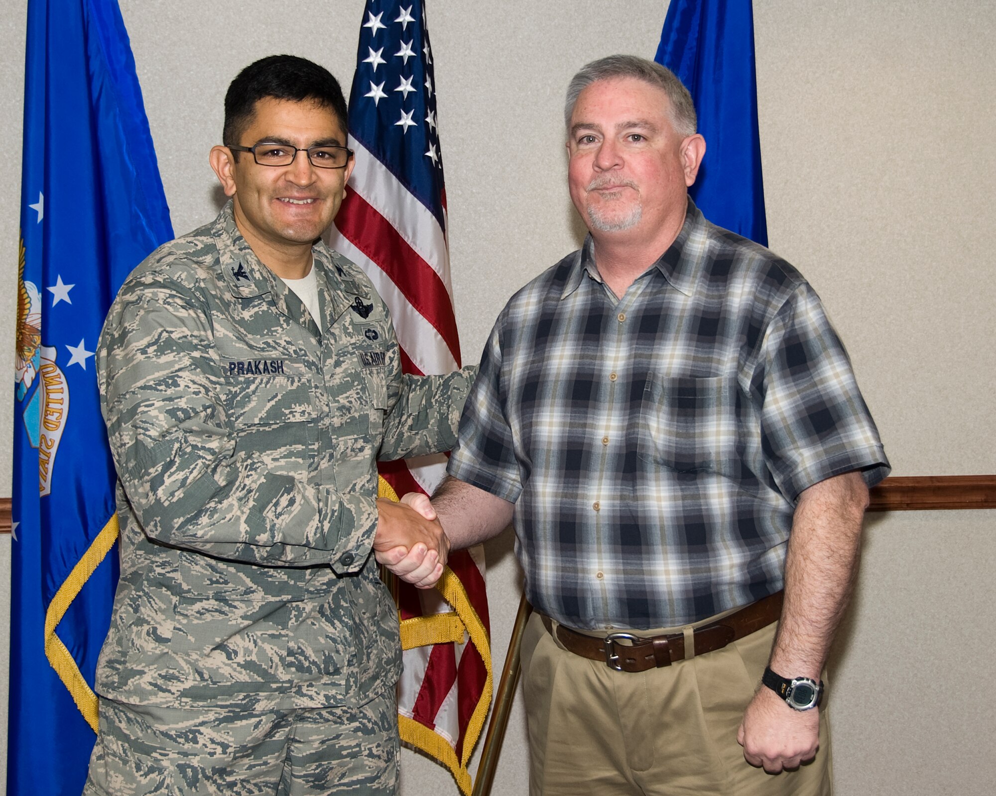 Col. Om Prakash (left), 82nd Training Wing vice-commander, congratulates James Jett, 82nd Training Wing Safety, for being named the "Commander's Wingman of Choice" for Dec. 3-7.  The award is given weekly for outstanding duty performance. (U.S. Air Force photo/Frank Carter)