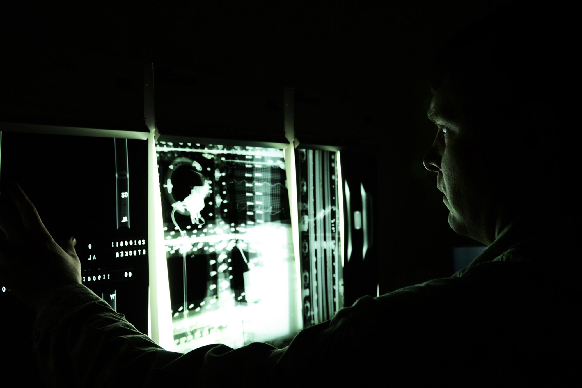 WRIGHT-PATTERSON AIR FORCE BASE, Ohio – During the 445th Airlift Wing’s Employer Appreciation Day, Senior Airman Dale Rowe, 445th Maintenance Squadron journeyman, demonstrates to employers how an X-ray film viewer is used to inspect sections of an airplane for defects. More than 50 employers and reservists attended various 445th Airlift Wing activities and demonstrations during the wing's Employer Appreciation Day June 2. (U.S. Air Force photo/Staff Sgt. Mikhail Berlin)