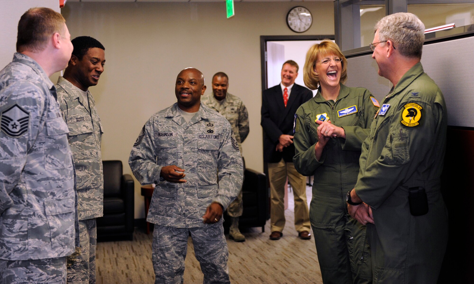 U.S. Air Force Maj. Gen. Margaret Woodward, Air Force Chief of Safety, meets the Air Combat Command Ground Safety team during a tour of ACC Safety headquarters, Joint Base Langley-Eustis, Va., Nov. 27, 2012. The ground safety team consists of eight Airmen and civilians and focuses on the reduction of all ground related mishaps, including vehicle and duty related. (U.S. Air Force photo by Staff Sgt. Krystie Martinez/Released)
