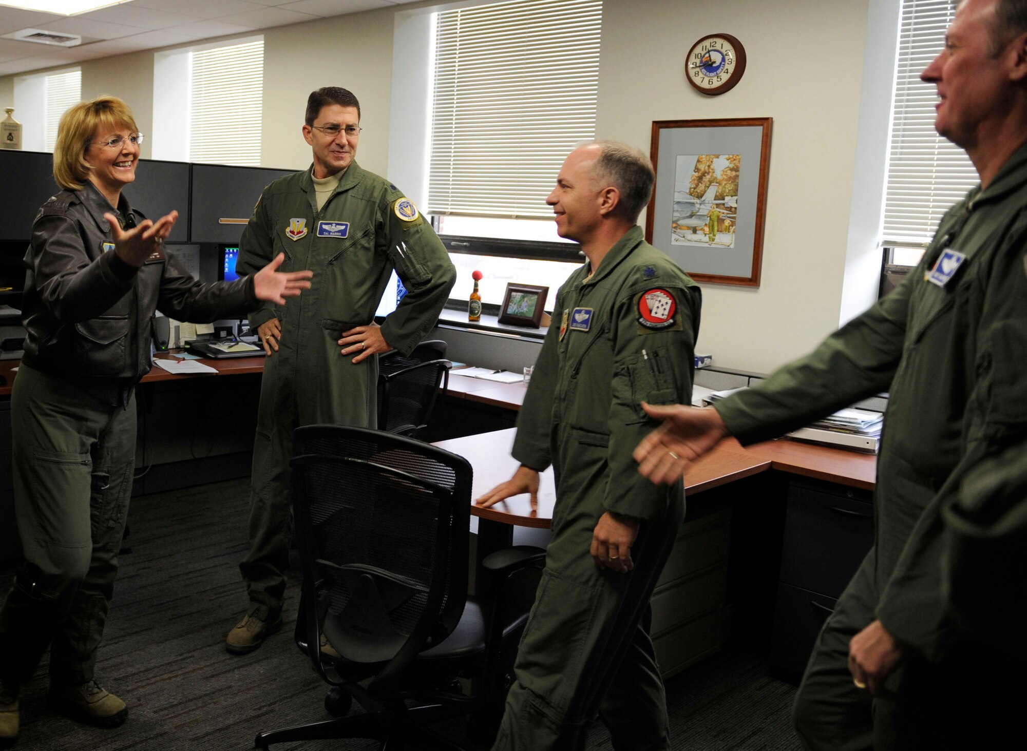 U.S. Air Force Maj. Gen. Margaret Woodward, Air Force Chief of Safety, left, meets the Air Combat Command Flight Safety Division team during a tour of ACC Safety headquarters, Joint Base Langley-Eustis, Va., Nov. 27, 2012. The flight safety team consists of seven Airmen focusing on all aspects of flight related safety. (U.S. Air Force photo by Staff Sgt. Krystie Martinez/Released)