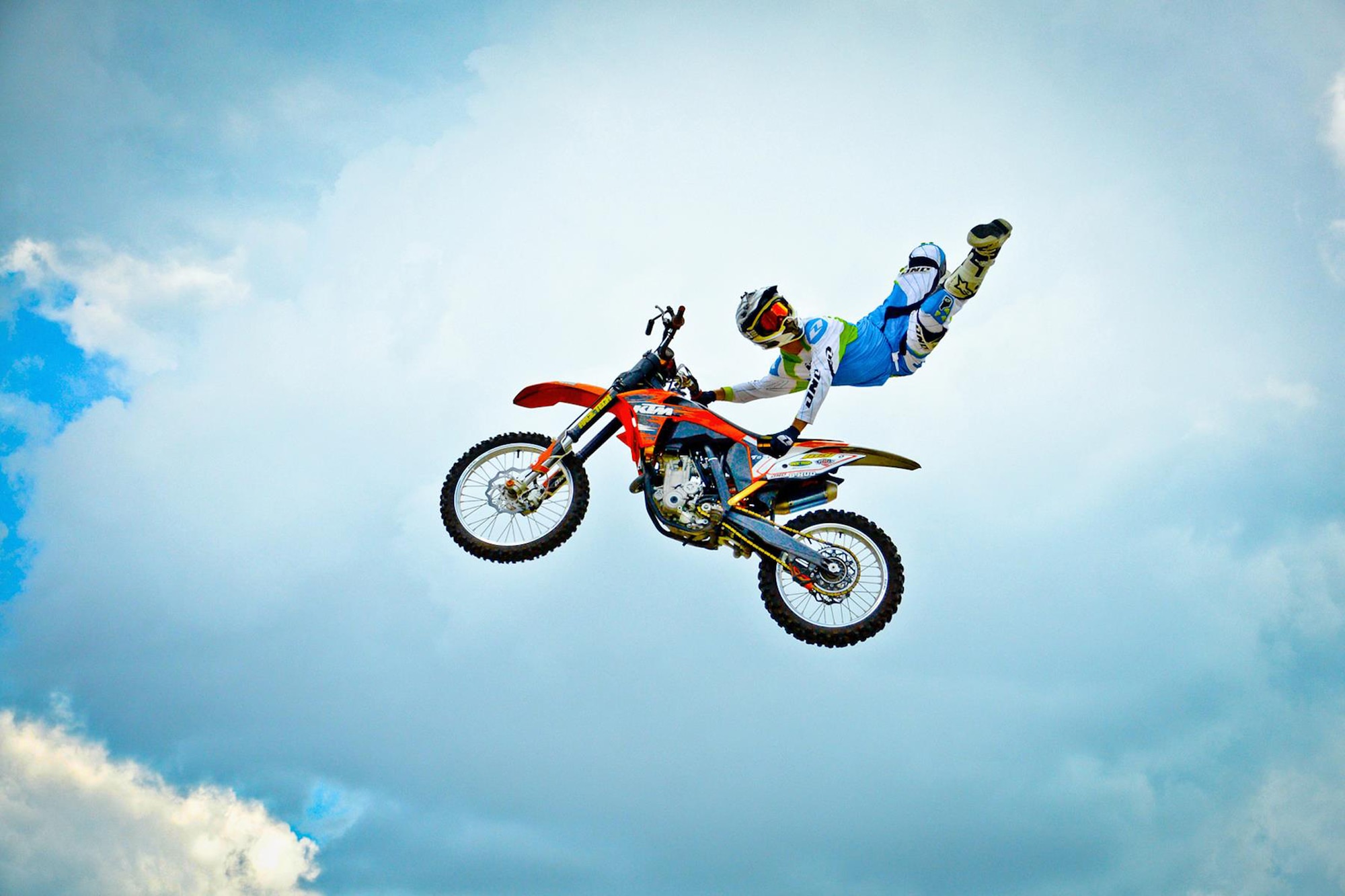 WRIGHT-PATTERSON AIR FORCE BASE, Ohio – 445th Airlift Wing reservists and their families had an opportunity to see motocross rider Bryce Hudson perform various stunts and maneuvers in the parking lot of the Base Exchange at Wright-Patterson Air Force Base, Ohio, July 16 and 17. Hudson and two other teammates are part of the Monster Energy Freestyle MX.com tour and were in the area performing stunts and signing autographs for the base community. (U.S. Air Force photo/Staff Sgt. Mikhail Berlin)