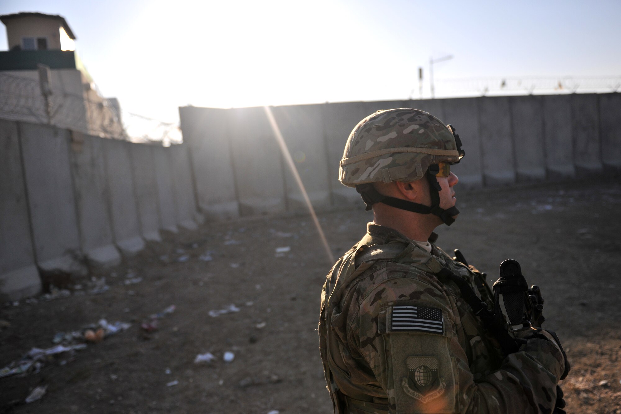 Master Sgt. Thomas Carpino, 455th Expeditionary Security Forces Group bravo sector superintendent, patrols the area outside an entry control point at Bagram Airfield, Afghanistan, Dec. 2, 2012.  455 EFSG teams patrol the base perimeter looking for suspicious activities while local Afghan civilians arrive to receive basic medical care.  (U.S. Air Force photo/Senior Airman Chris Willis)