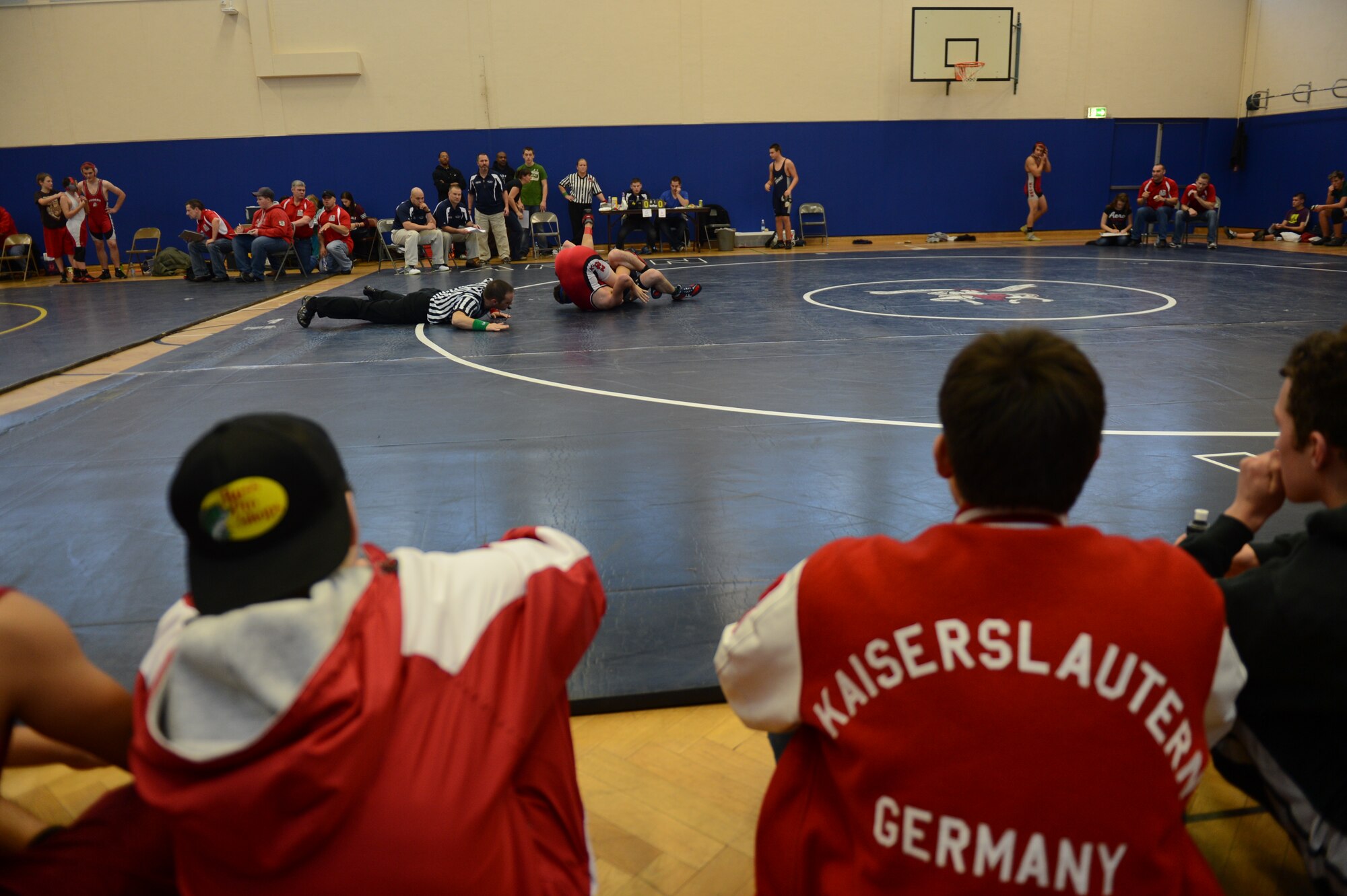 BITBURG ANNEX, Germany – Wrestlers from Kaiserslautern High School watch their teammate during a wrestling tournament at Bitburg High School Dec. 1, 2012.  Students from four Department of Defense Dependants Schools-Europe participated in the tournament, which was the first of the winter sports season. (U.S. Air Force photo by Airman 1st Class Gustavo Castillo/Released)