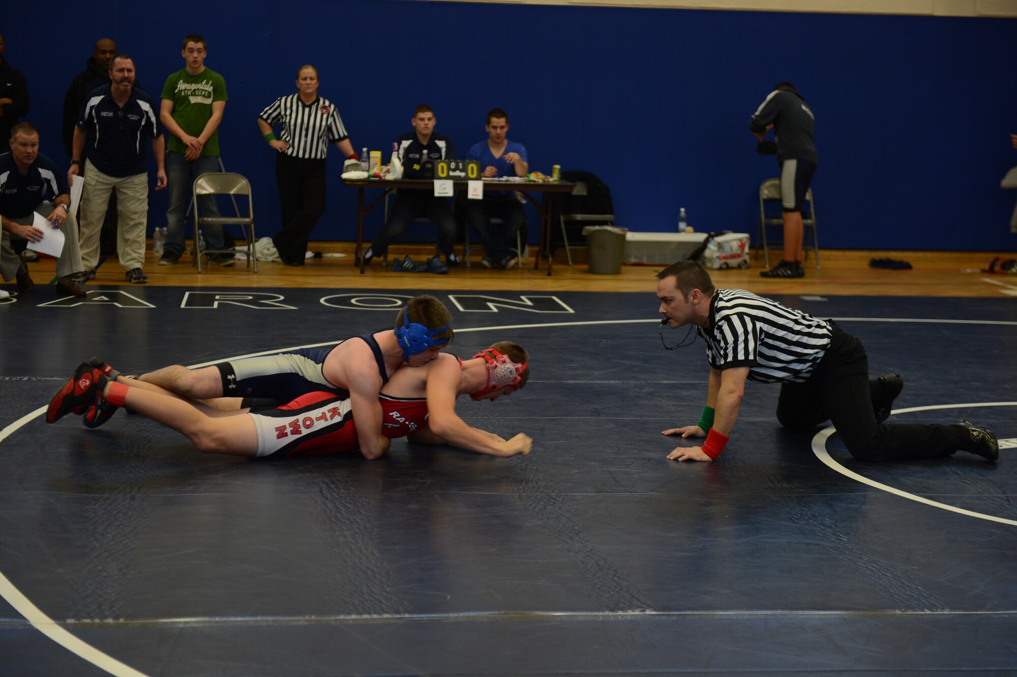 BITBURG ANNEX, Germany – Bitburg Baron senior Evan Less holds down Kaiserslautern Raider sophomore Bradley Lemon during a wrestling match at Bitburg High School Dec. 1, 2012. Less dominated Lemon and   two other matches out of four in the tournament. (U.S. Air Force photo by Gustavo Castillo/Released)