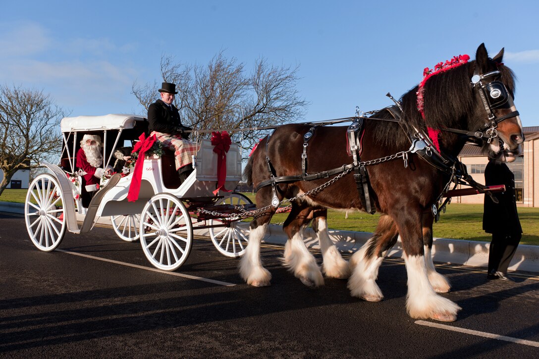 RAF ALCONBURY, United Kingdom – Santa rides in a horse-drawn carriage around RAF Alconbury during the annual Holiday Parade Dec. 1. The parade ended at the Community Activities Center where Santa’s Grotto was set up and he began getting children’s wish lists. (U.S. Air Force photo by Staff Sgt. Brian Stives)