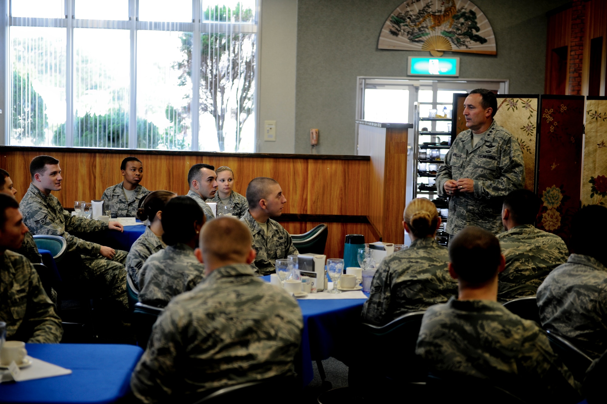 U.S. Air Force Lt. Gen. Stephen Mueller, Inspector General of the Air Force, speaks with Airmen from different squadrons regarding the recent curfew restrictions and gives them a positive outlook on the issue during his visit to Kadena Air Base, Japan, Dec. 4, 2012. Mueller's direct interaction with Kadena Airmen generated discussion that he will take back to the Pentagon. (U.S. Air Force photo/Airman 1st Class Justin Veazie)
