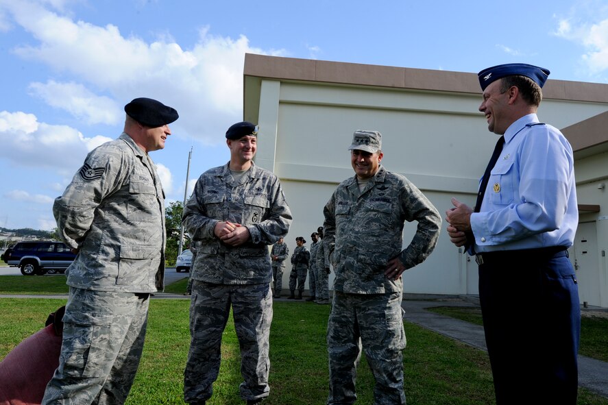 U.S. Air Force Lt. Gen. Stephen Mueller, Inspector General of the Air Force, talks with Col. Jeffrey Ullman, 18th Mission Support Group commander, Master Sgt. Christopher Manning, 18th Security Forces Squadron kennel master and Tech. Sgt. Billy Burgan, 18th Security Forces Squadron military working dog trainer, about the K-9 department during his visit to Kadena Air Base, Japan, Dec. 4, 2012. The Air Force Inspector General visited Kadena during his Pacific Air Force Orientation tour. (U.S. Air Force photo/Airman 1st Class Justin Veazie)

