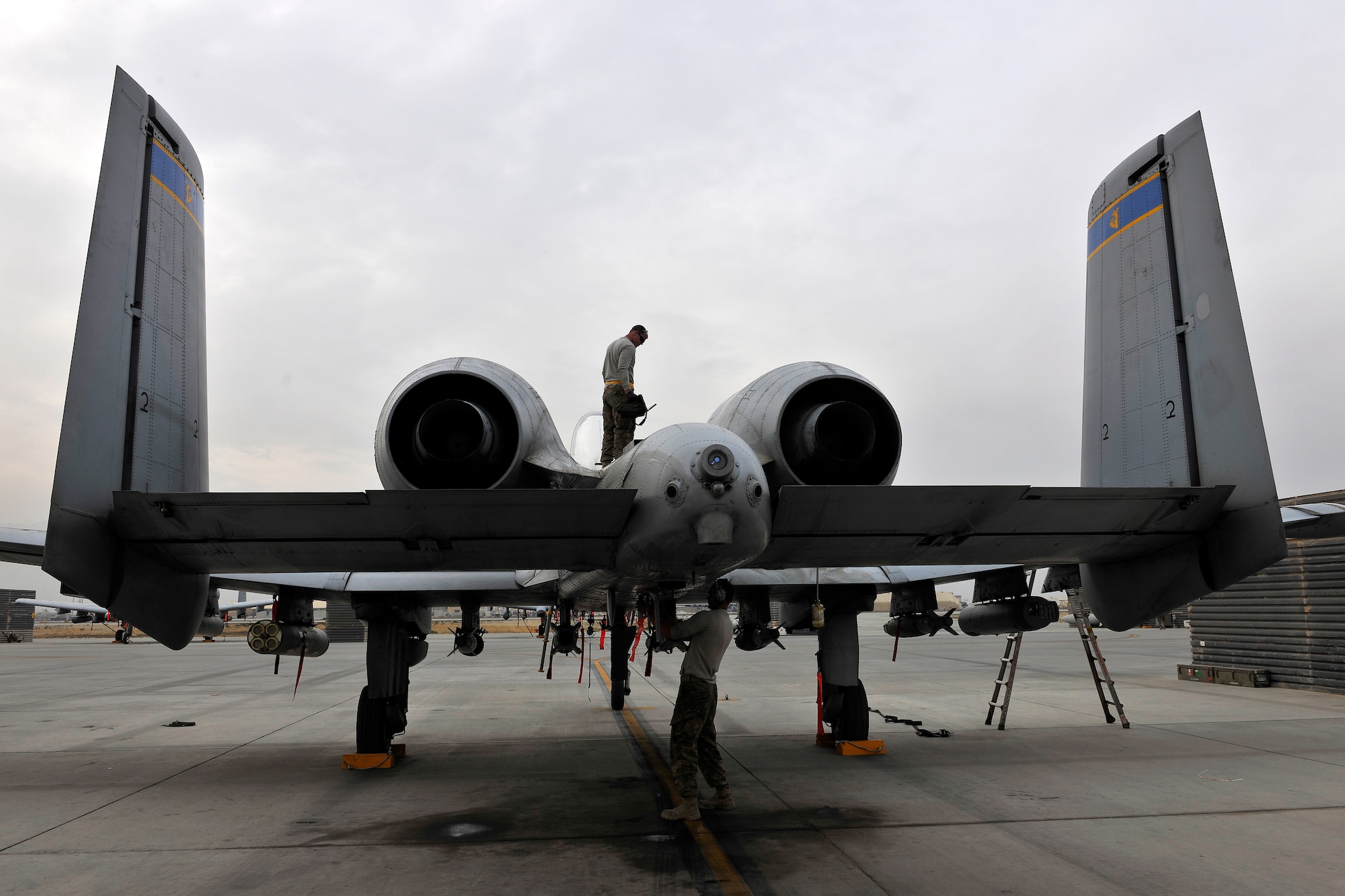 Two aircraft maintainers assigned to the 455th Expeditionary Aircraft Maintenance Squadron perform a post-mission inspection on an A-10 Thunderbolt II at Bagram Airfield, Afghanistan, Nov. 27, 2012. The A-10 is part of a squadron of “Warthogs” that recently arrived from Davis-Monthan Air Force Base, Az., to fly missions in support of American and coalition forces here in Afghanistan. (U.S. Air Force photo/Senior Airman Chris Willis)
