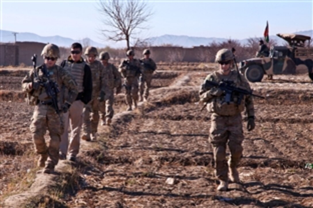 U.S. soldiers conduct a patrol during a combat operation in Kotub Khel, near Combat Outpost McClain in eastern Afghanistan's Logar province, Nov. 26, 2012. The soldiers are assigned to the 1st Squadron, 91st Calvary Regiment, 173rd Airborne Brigade Combat Team.