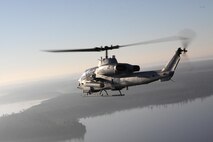 An AH-1W Cobra with Marine Light Attack Helicopter Squadron 167 flies 
toward Marine Corps Base Camp Lejeune to direct artillery fire across the 
New River during a training mission with 3rd Battalion, 10th Marines from 
Camp Lejeune, Nov. 29. HMLA took three Marines from the battalion to 
familiarize them with the procedures used in the air.

