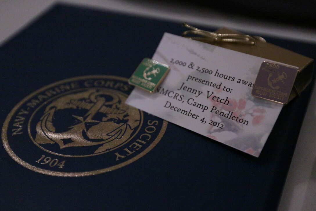 The Navy Marine Corps Relief Society here held a luncheon at the Pacific Views Event Center here Dec. 4. Volunteers with 100 or more volunteer hours were presented certificates and gifts during the semi-annual luncheon.