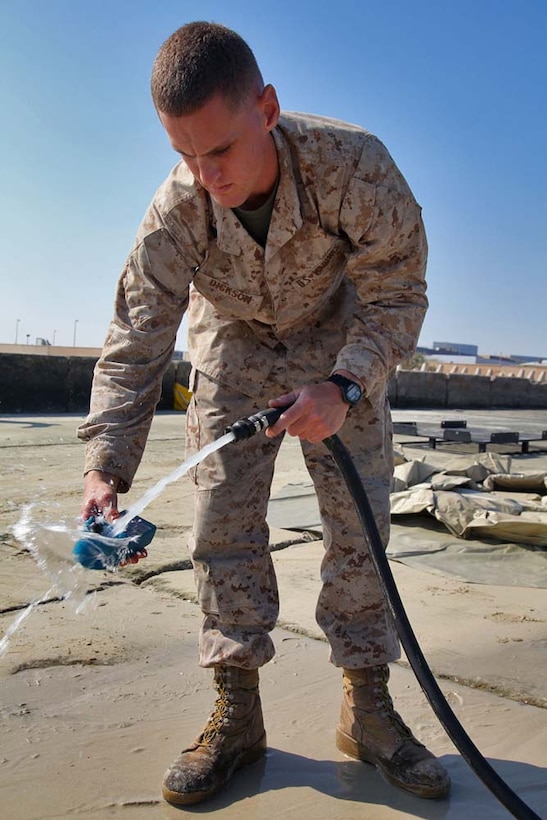 Corporal Daniel Dickson, water support technician, Engineer Detachment, Combat Logistics Battalion 15, 15th Marine Expeditionary Unit, tests water from a Light-Weight Water Purification System for impurities while conducting a function test of the equipment at Camp Patriot, Kuwait, Nov. 28. The Marines recently completed Eager Mace 13, a routine training exercise that focused on promoting regional security, stability and mutual interests in the region. The 15th MEU is deployed as part of the Peleliu Amphibious Ready Group as a U.S. Central Command theater reserve force, providing support for maritime security operations and theater security cooperation efforts in the U.S. 5th Fleet area of responsibility. Dickson, 20, is from Antioch, Calif. (U.S. Marine Corps photo by Cpl. Timothy R. Childers)