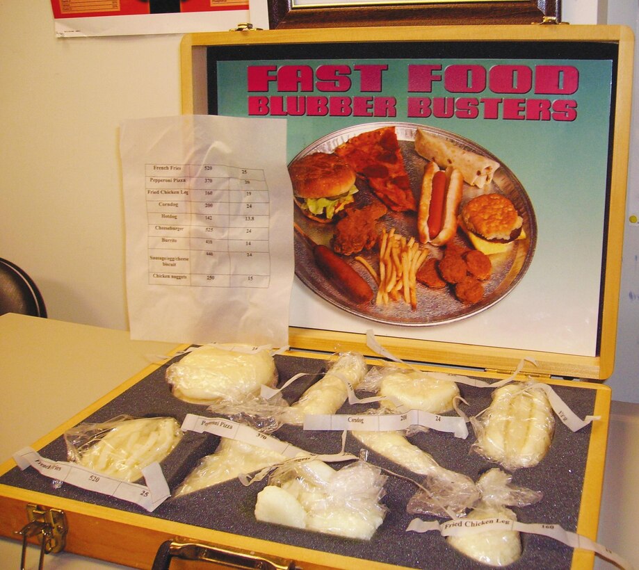A Fast Food Blubber Busters case displays the fat content of most known fast food items. Naval Branch Health Clinic Albany officials encourage individuals to eat healthy during the holidays.