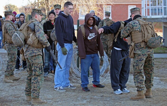 Marines at the entry control point do an initial search of the role players to make sure they are not carrying weapons or anything dangerous. Marines and sailors with 2nd Battalion, 2nd Marine Regiment, 2nd Marine Division, participate in their first field exercise in preparation for the upcoming Black Sea Rotational Force deployment.