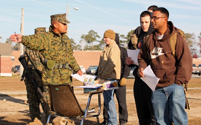 Gunnery Sgt. Jose Reese, a maintenance chief with 2/2, explains the different stations of the evacuation control center to role players. Marines and sailors with 2nd Battalion, 2nd Marine Regiment, 2nd Marine Division, participate in their first field exercise in preparation for the upcoming Black Sea Rotational Force deployment.