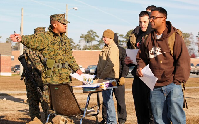 Gunnery Sgt. Jose Reese, a maintenance chief with 2/2, explains the different stations of the evacuation control center to role players. Marines and sailors with 2nd Battalion, 2nd Marine Regiment, 2nd Marine Division, participate in their first field exercise in preparation for the upcoming Black Sea Rotational Force deployment.