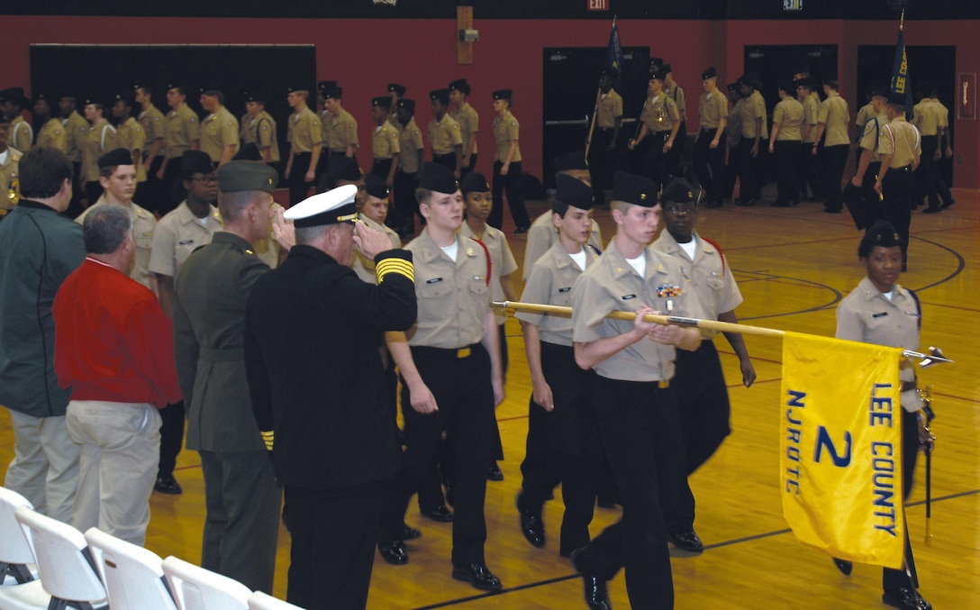 Maj. Mike Mullins, deputy manager, Center Operations Division, Maintenance Management Center, Marine Corps Logistics Command, serves as the guest inspector during Lee County High School Navy Junior Reserve Officers Training Corps’ annual inspection, Nov. 30. Mullins participated in a pass in review during the inspection. 