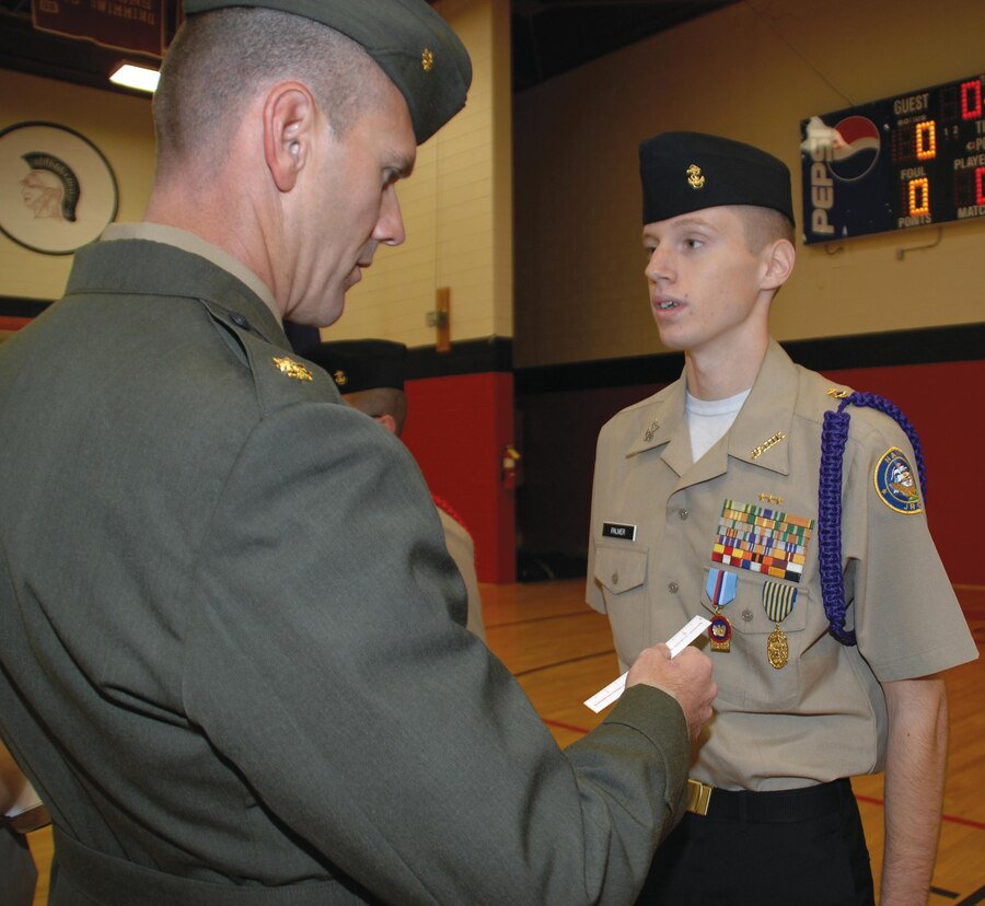Maj. Mike Mullins, deputy manager, Center Operations Division, Maintenance Management Center, Marine Corps Logistics Command, serves as the guest inspector during Lee County High School Navy Junior Reserve Officers Training Corps’ annual inspection, Nov. 30.