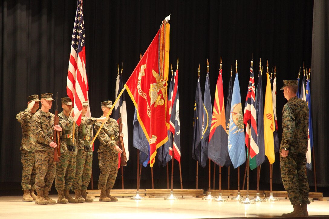 Brig. Gen. Gary L. Thomas, commanding general of 2nd Marine Aircraft Wing (Forward), salutes the colors shortly after uncasing them during a ceremony signifying the official activation of the unit at Cherry Point Nov. 30.