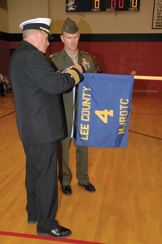 Maj. Mike Mullins, deputy manager, Center Operations Division, Maintenance Management Center, Marine Corps Logistics Command, serves as the guest inspector during Lee County High School Navy Junior Reserve Officers Training Corps’ annual inspection, Nov. 30.
