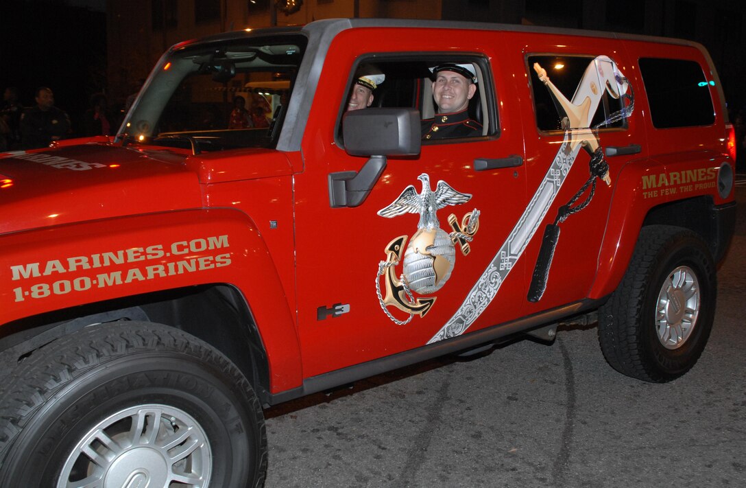 Col. Don Davis, commanding officer, Marine Corps Logistics Base Albany, and Sgt. Rufus McCarley, local Marine recruiter, help lead the 22nd annual Celebration of Lights Parade, Saturday.