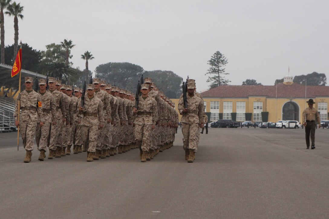 Staff Sgt. Nicholas Casias, senior drill instructor, Platoon 2109, Company E, 2nd Recruit Training Battalion, marches his platoon past the reviewing stand during the final drill competition Nov. 26. Final drill is judged by how well a platoon performs each movement.