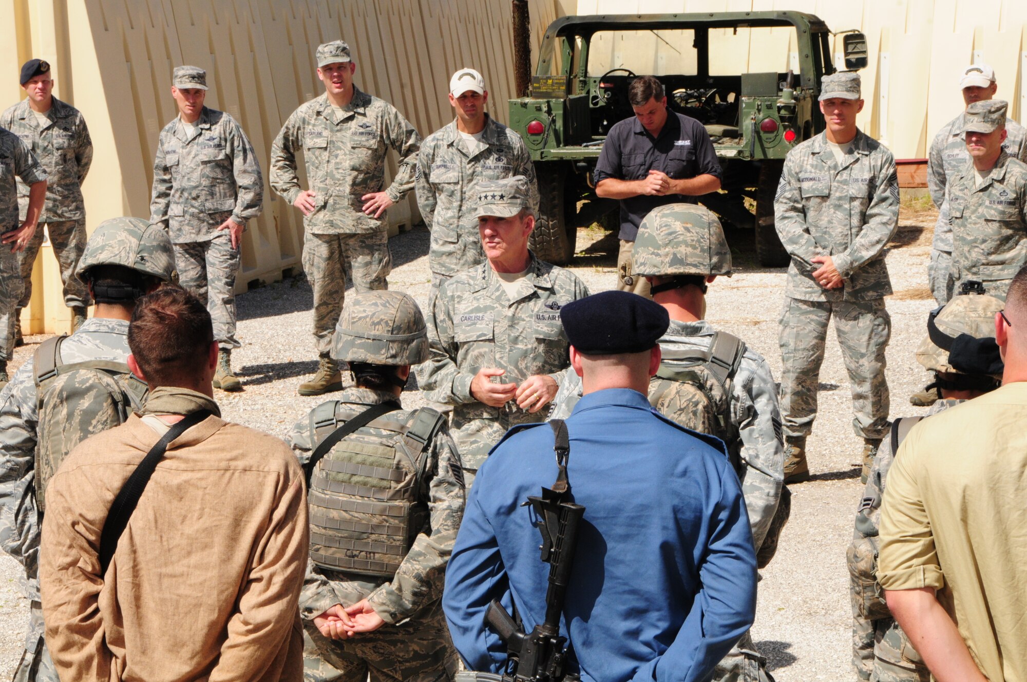 Gen. Herbert “Hawk” Carlisle, Pacific Air Forces commander, speaks to members of the 736th Security Forces Squadron after a counter improvised explosives device training demonstration at Northwest Field, Guam, Dec. 3, 2012.  General Carlisle was presented with the different contingency capabilities that the 36th Contingency Response Group provides to the Asia-Pacific theater of operations. (U.S. Air Force photo by Airman 1st Class Marianique Santos/Released)