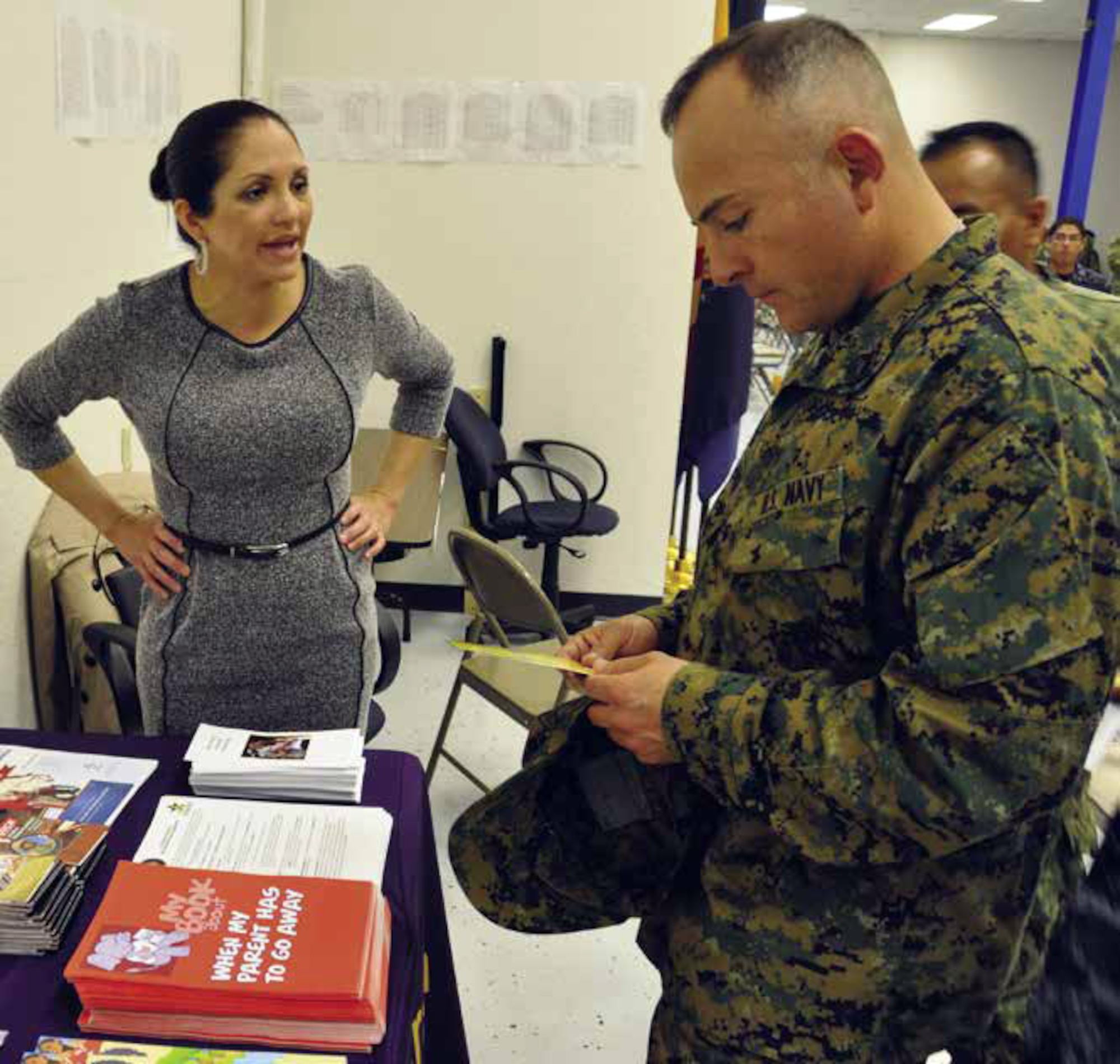 Jeannette Casillas from the Naval Base Coronado Sexual Assault Response and Prevention office discusses the topic with Navy members and their spouses during the one-day Deployment Readiness Training held at the Naval Operational Support Center Dec. 1. The training is provided to members who are within 18 months of deployment, or part of a mobilization pool. (U.S. Air Force photo by Staff. Sgt. Joe Davidson)