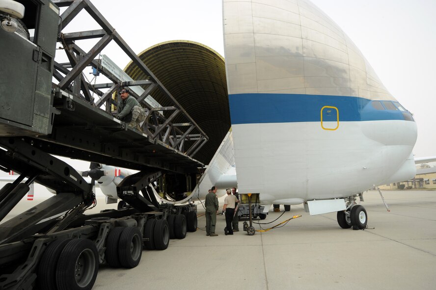 The National Aeronautics and Space Administration’s massive tadpole-shaped aircraft is aptly named “Supper Guppy” and is not only one-of-a-kind in appearance, but also in the operation of its cargo door. A disconnect system at the fuselage break allows the nose to open 110 degrees without interfering with the flight controls. The aircraft was a March Air Reserve Base, Nov. 27, to transport an enormous metal ring that will be used to test NASA’s Orion Multi-Purpose Crew Vehicle. (U.S. Air Force photo by Tech. Sgt. Christine Jones)