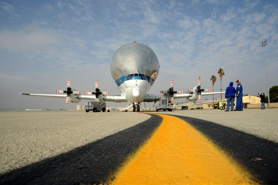 The National Aeronautics and Space Administration’s Super Guppy, shown parked on the March Air Reserve Base transit alert pad, Nov. 27, was tasked with transporting an enormous metal ring that will be used to test NASA’s Orion Multi-Purpose Crew Vehicle. The awkwardly shaped aircraft is specifically designed to carry oversized payloads and has been in service since August 1965. (U.S. Air Force photo by Tech. Sgt. Christine Jones)