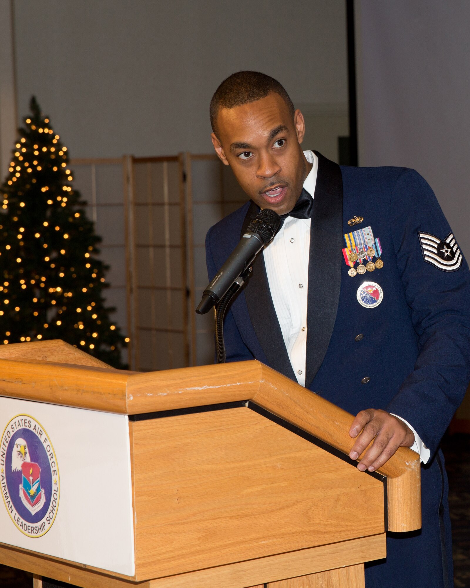 YOKOTA AIR BASE, Japan -- U.S. Air Force Tech. Sgt. Joe Gamble, 374th Force Support Squadron Professional Military Education instructor, announces his flight graduates during the Airman Leadership School Class 13-A graduation ceremony at Yokota Air Base, Japan, Dec. 6, 2012. (U.S. Air Force photo by Osakabe Yasuo)